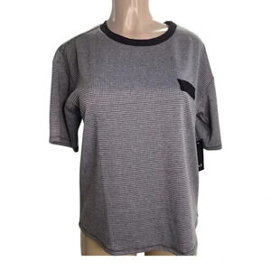 NAIF Size Large Women’s Print Material Short Sleeve Top. New With Tags.